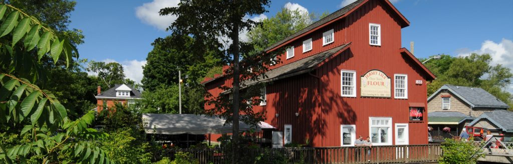 Historic red mill beside the river