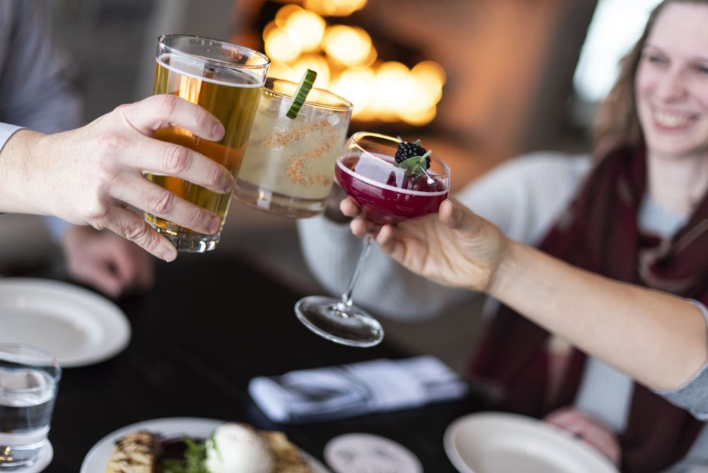 Friends raising drinks in a toast