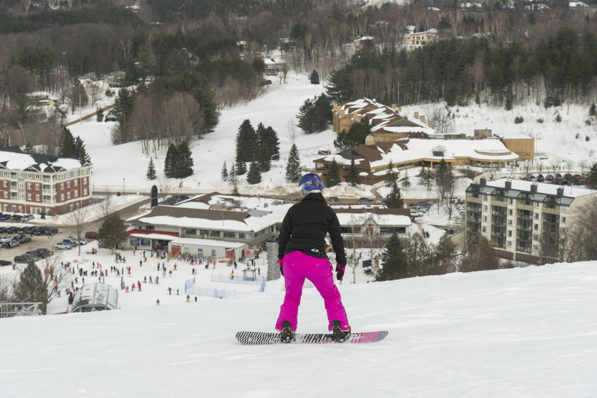 Snowboarding girl at horseshoe resort in the winter oro-medonte