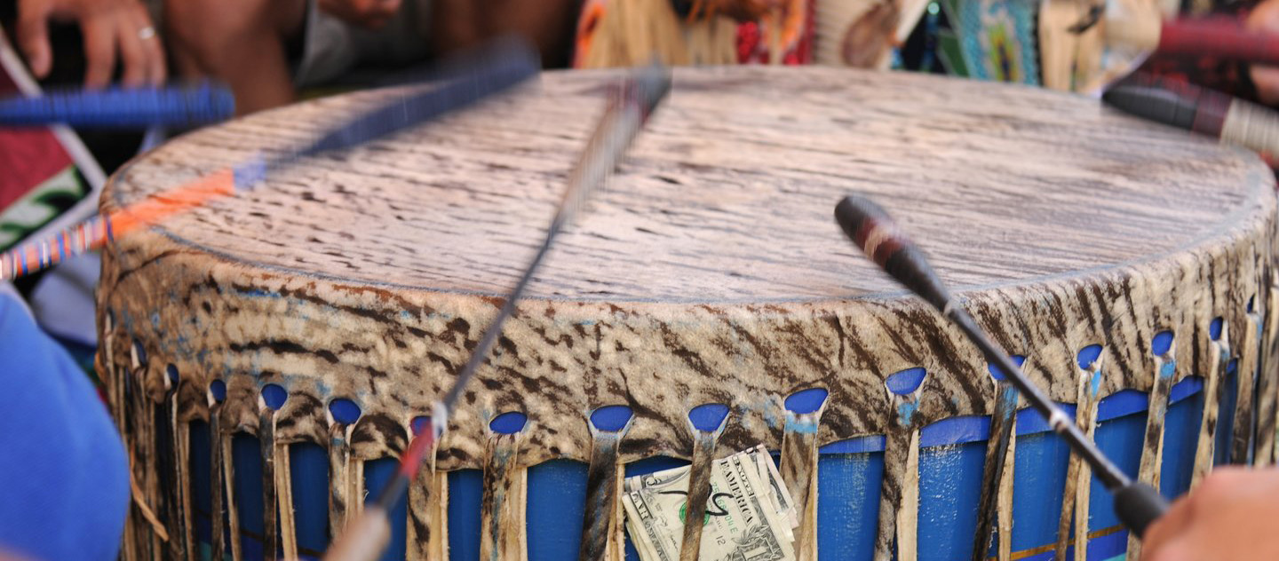 Hands playing a traditional hand drum