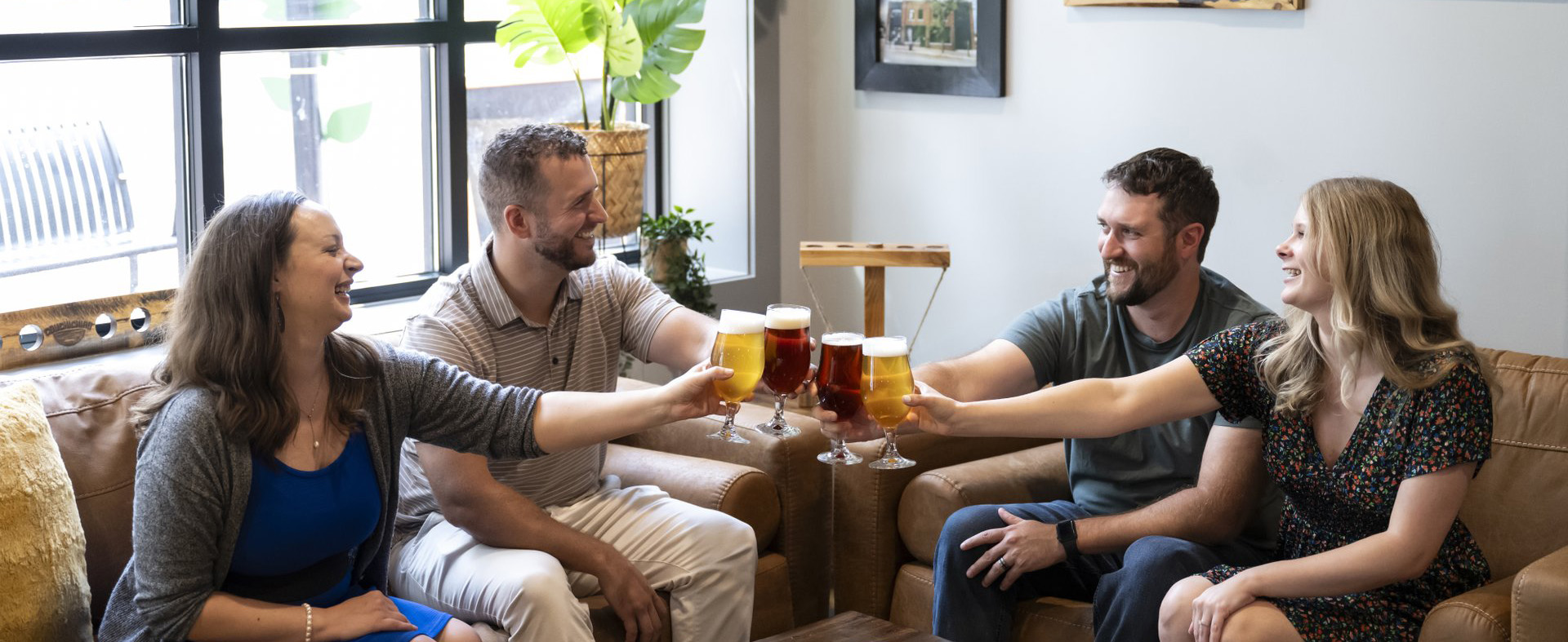 Friends raising drinks in a pub