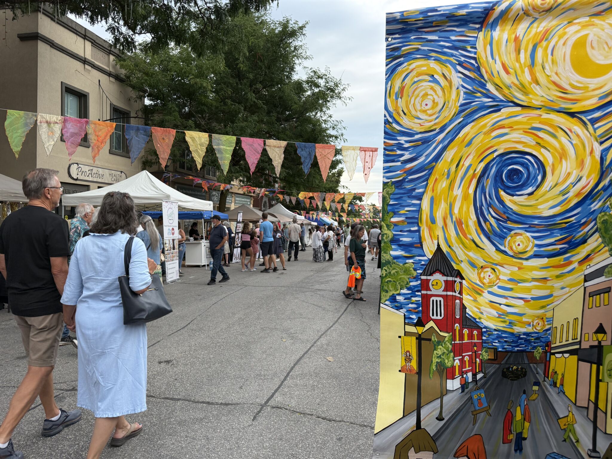 Visitors viewing outdoor artwork during Starry Night in downtown Orillia