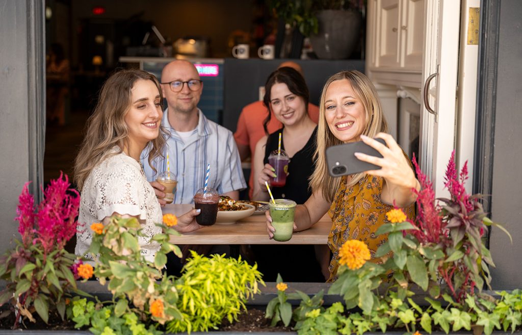 Friends dining together on a restaurant patio